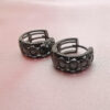 Black huggie hoops with black stone inserts