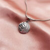 Half crystal circular pendant with round snake chain