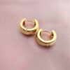 Golden huggie hoops