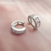 Silver huggie hoops with glass crystal inserts